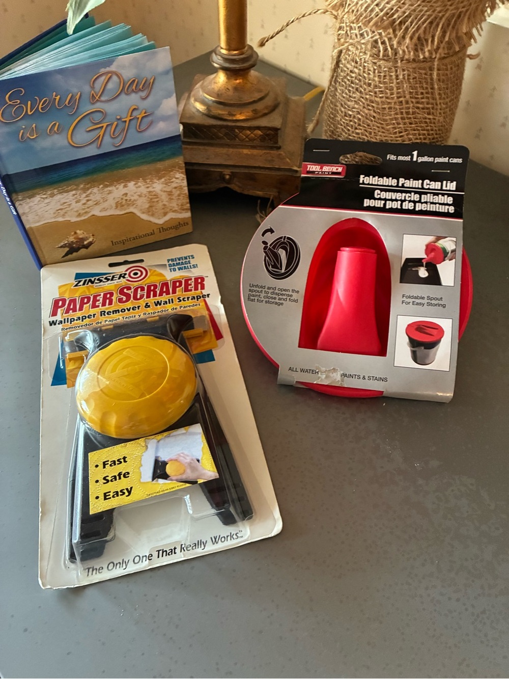 2 pieces, NEW IN PACKAGE, 1 Zinsser wall paper scraper and 1 paint lid cover.